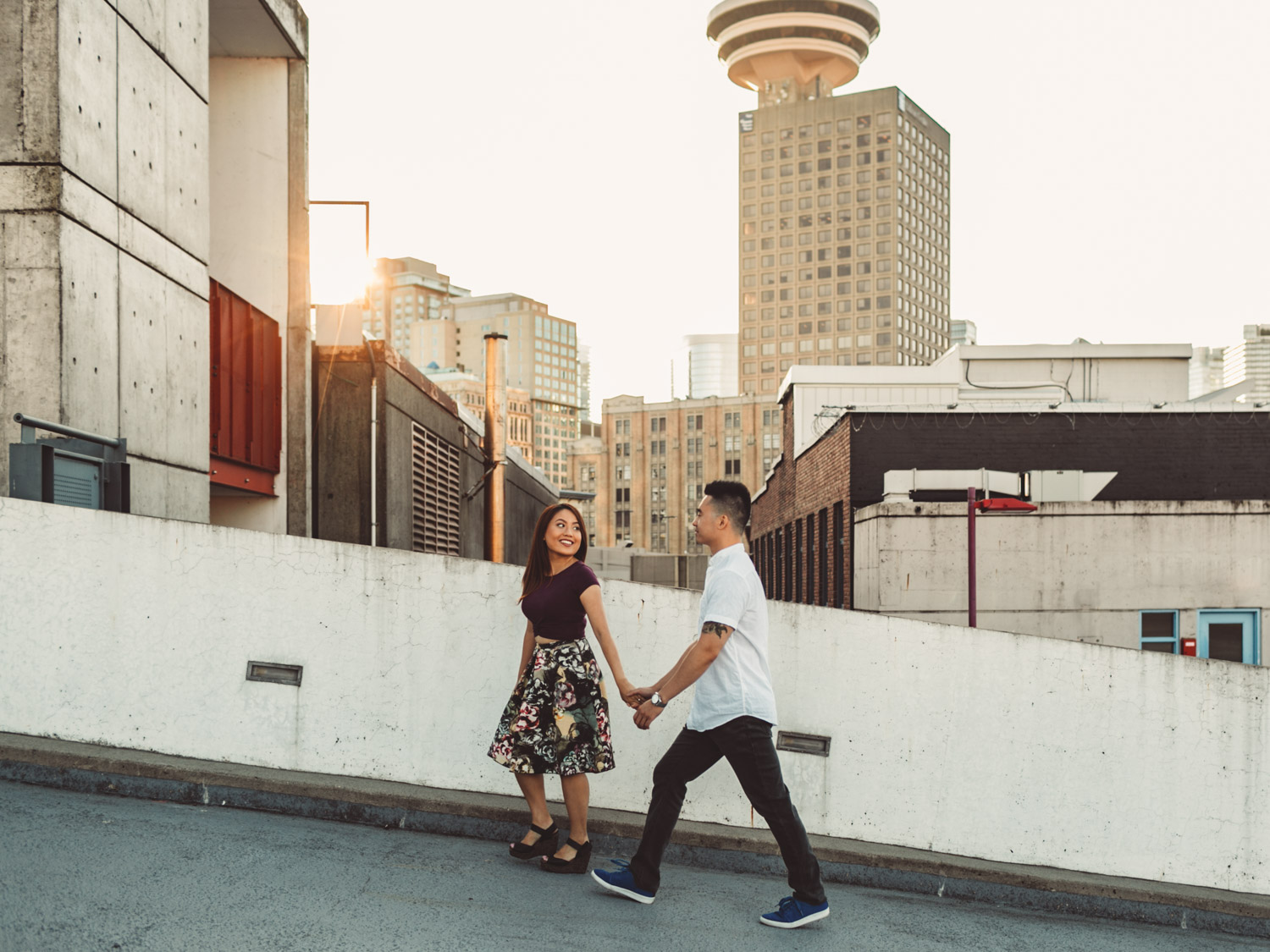 engagement photographer in vancouver at gastown during sunset on rooftop