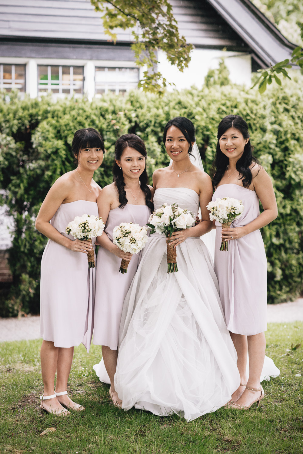 bride and bridesmaids portrait at brockhouse restaurant wedding in vancouver bc
