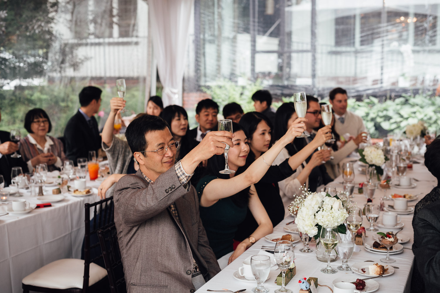 cheers toasting at brockhouse restaurant wedding lunch reception in vancouver bc