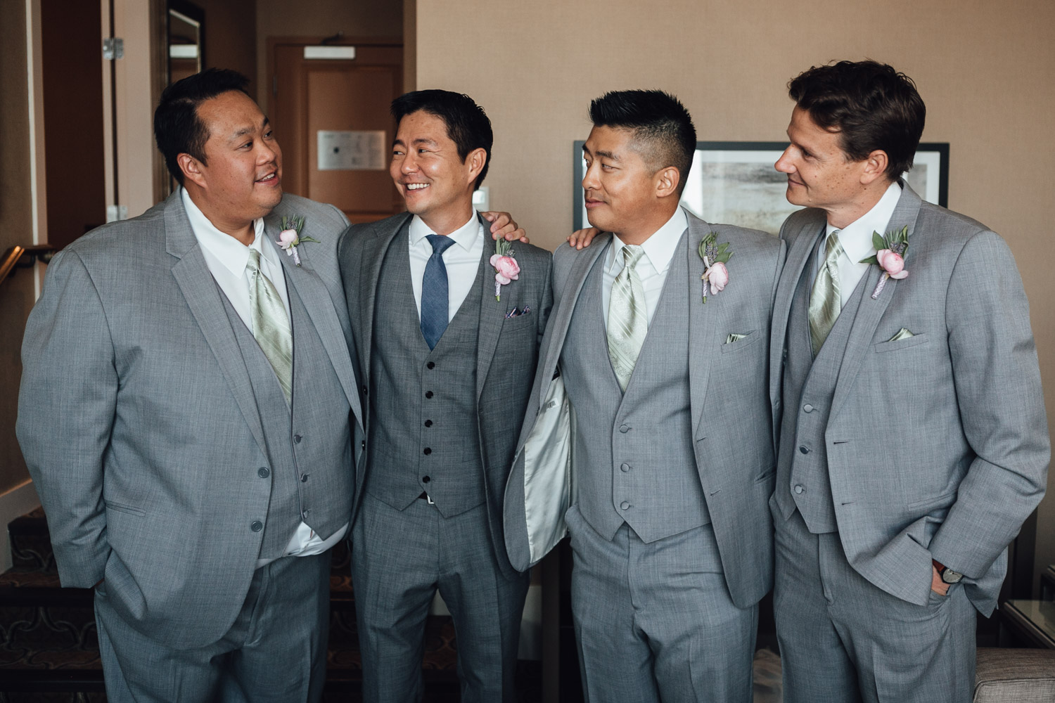 groomsmen and groom candid at river rock casino in richmond bc wedding photography