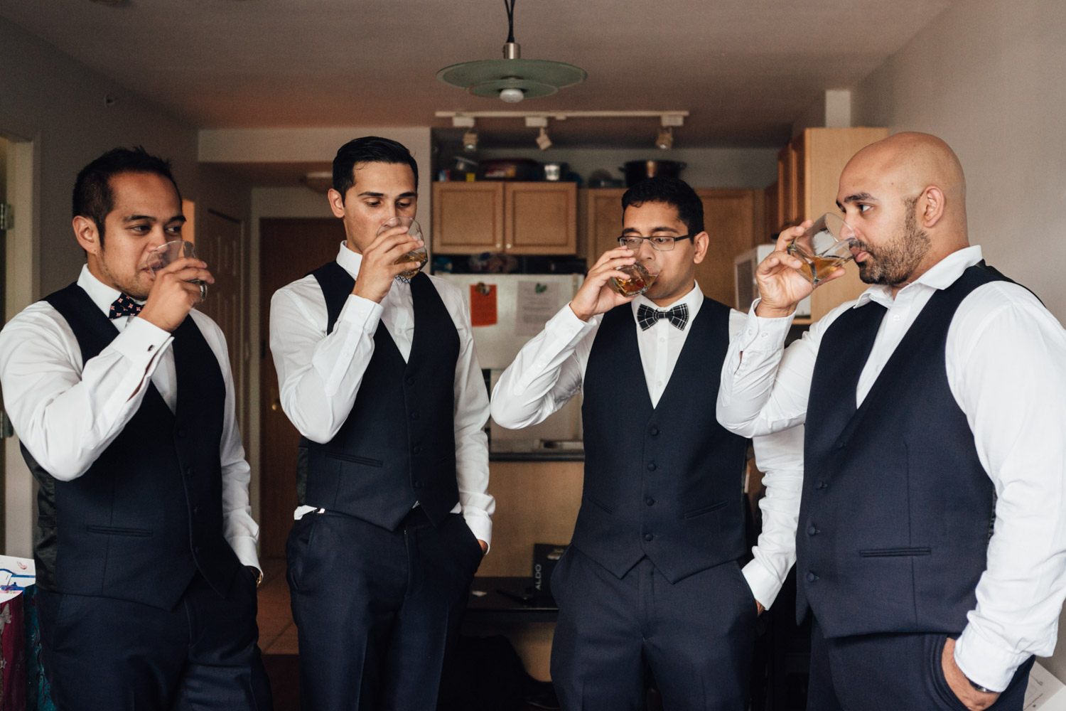 whiskey cheers with groom and groomsmen vancouver wedding photography
