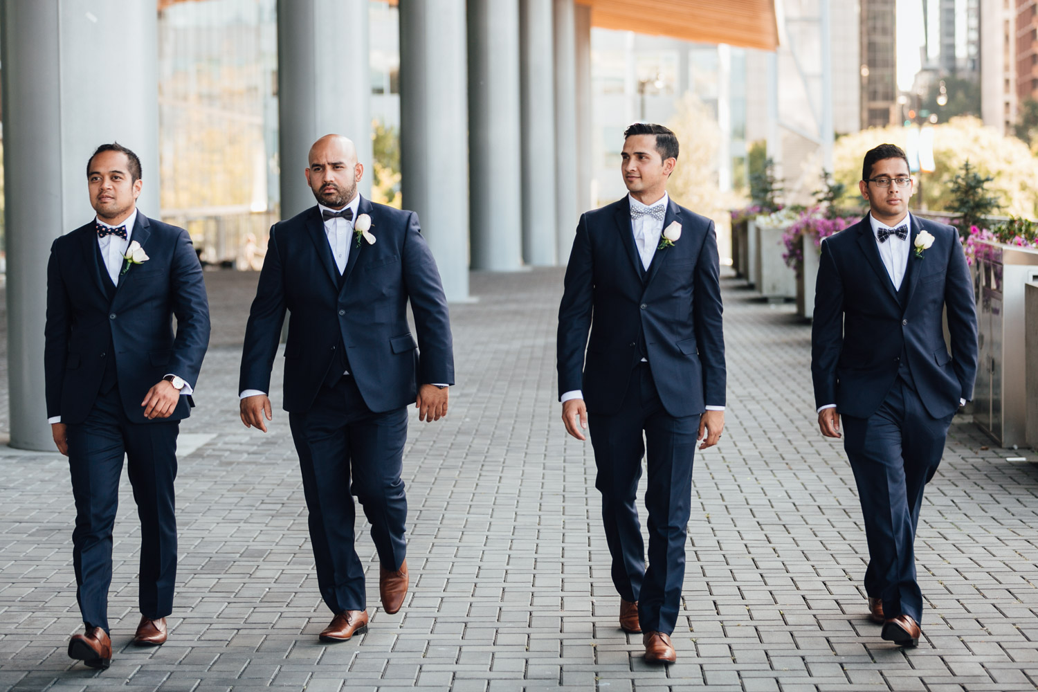 groomsmen and groom walking candid at the vancouver convention centre wedding