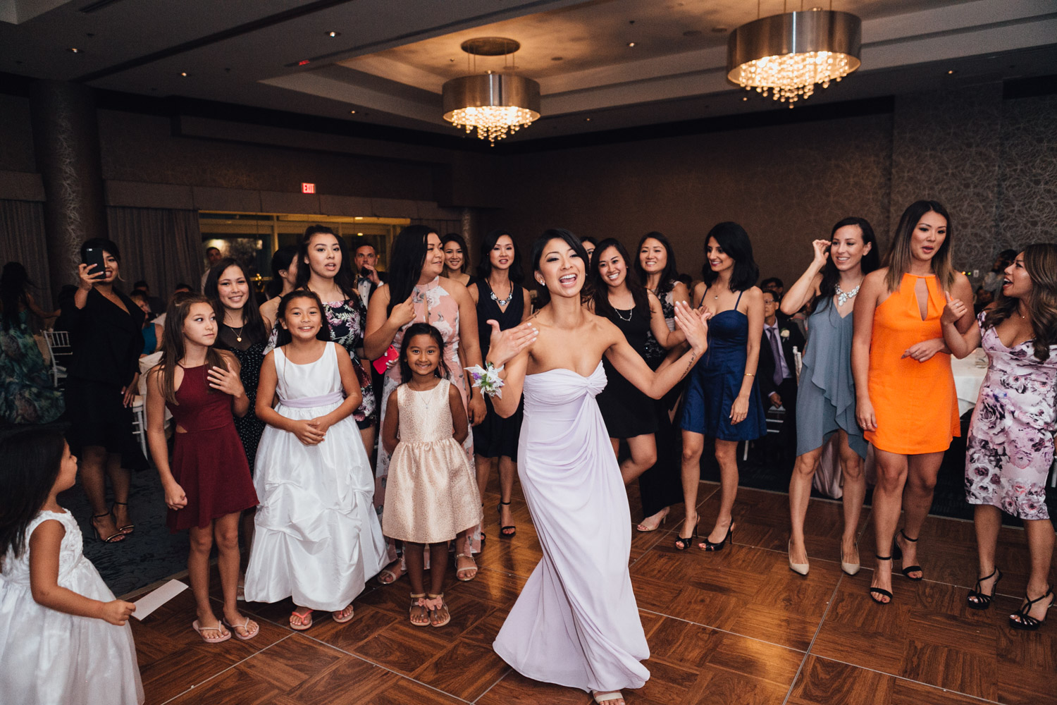 bouquet toss wedding reception photography in north vancouver pinnacle at the pier amie nguyen