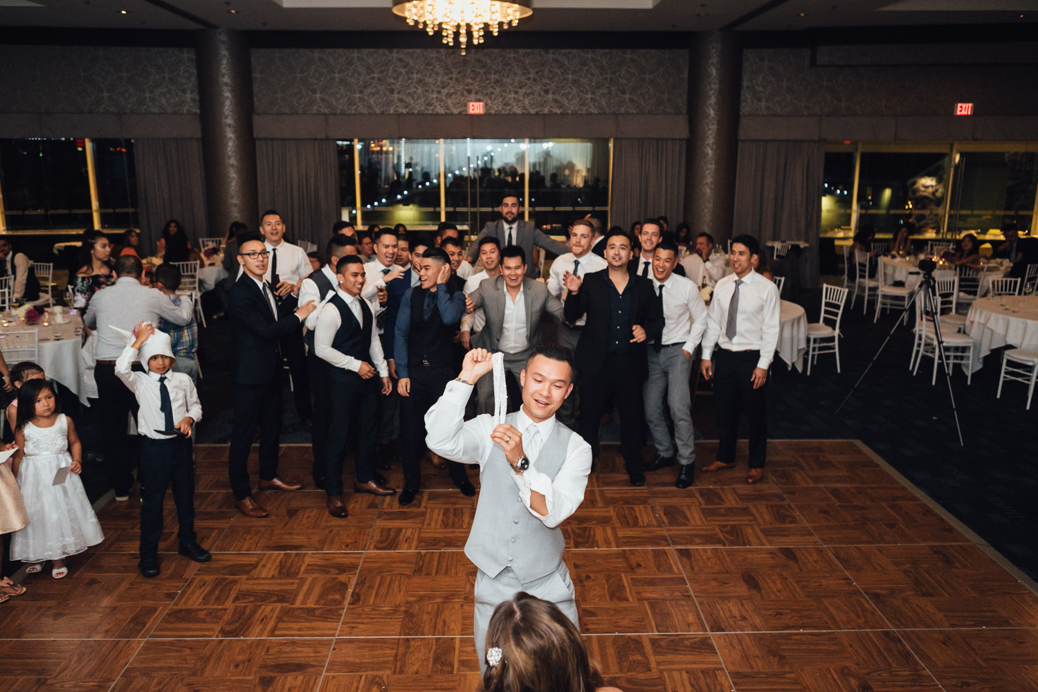 garter toss groom wedding reception at pinnacle at the pier in north vancouver photography