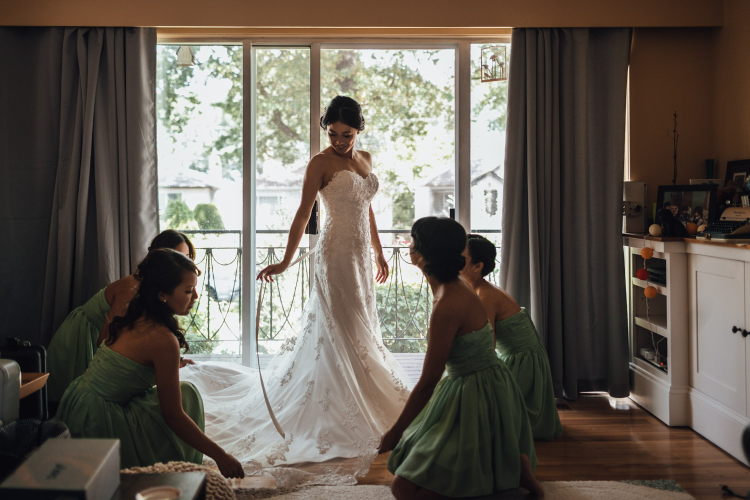 bride putting on wedding dress vancouver photography bc