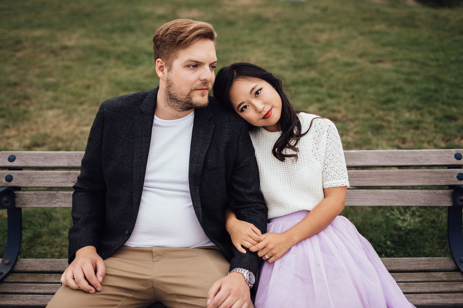 north vancouver couple sitting on bench laughing candid engagement photography pinterest