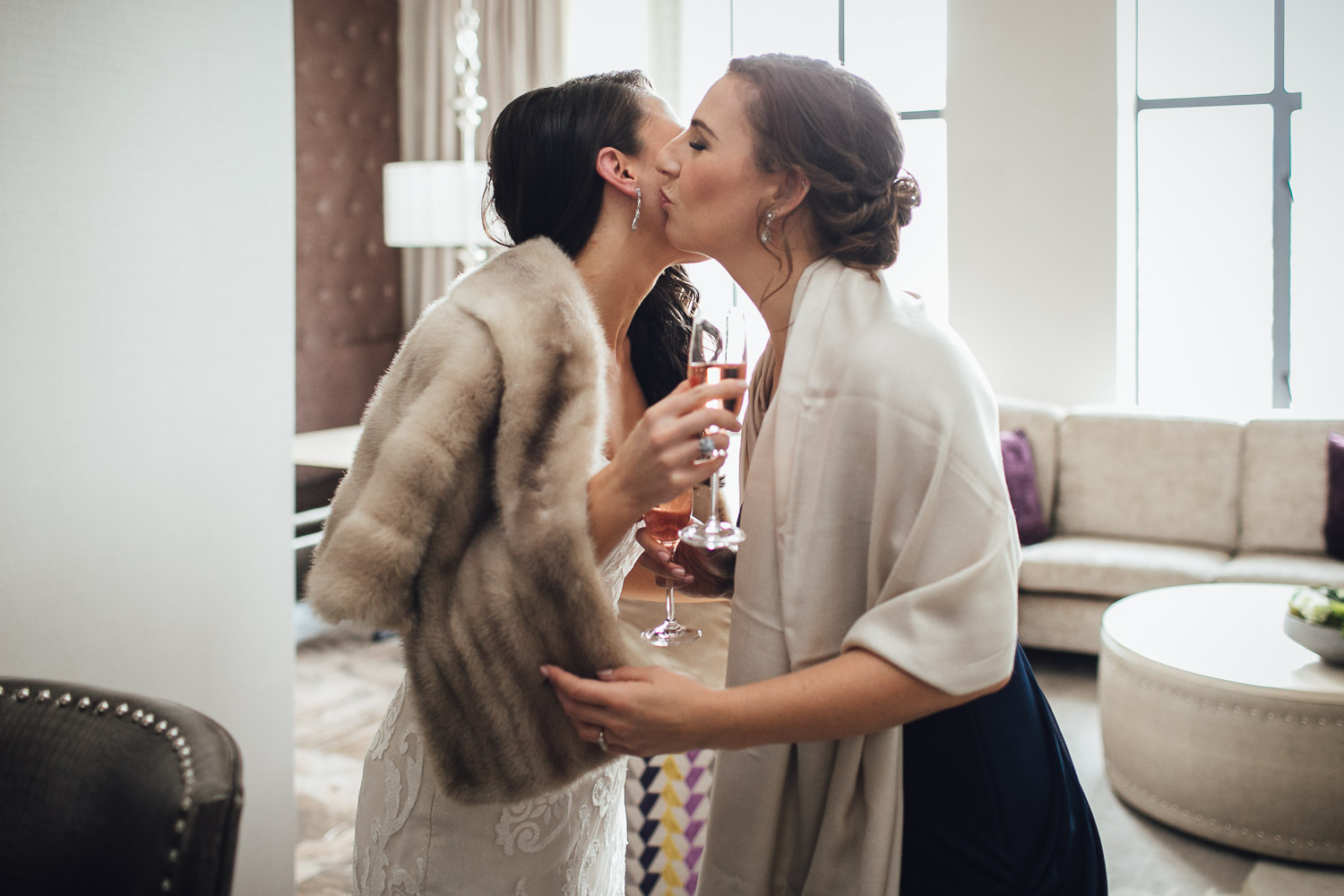 bride and sister kiss wedding photography burnaby delta hotel
