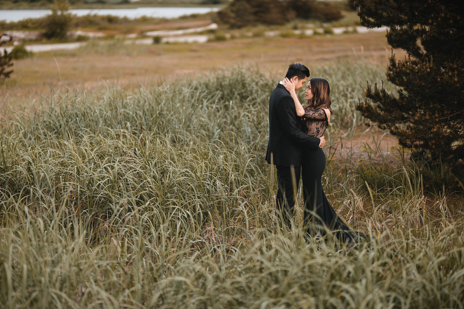 engagement photography in field at wild park iona beach in richmond bc