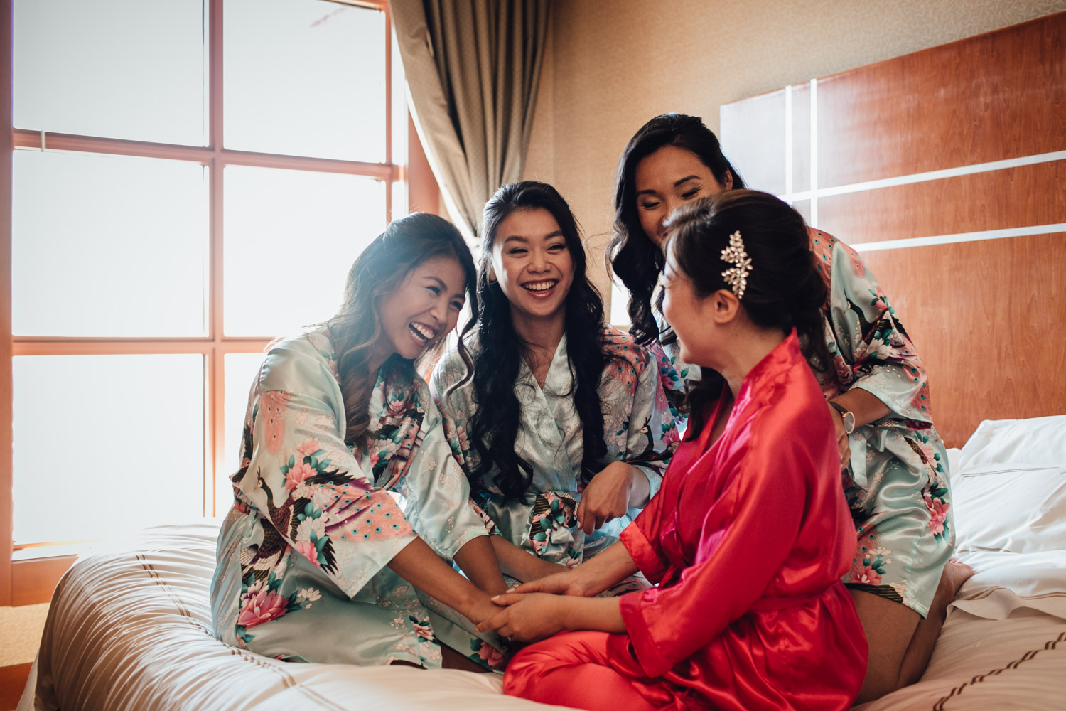 bride and bridesmaids river rock casino hotel bed candid wedding photography