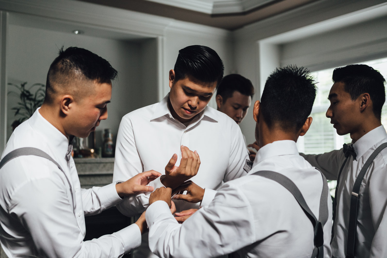 groom getting ready for wedding photography in vancouver bc