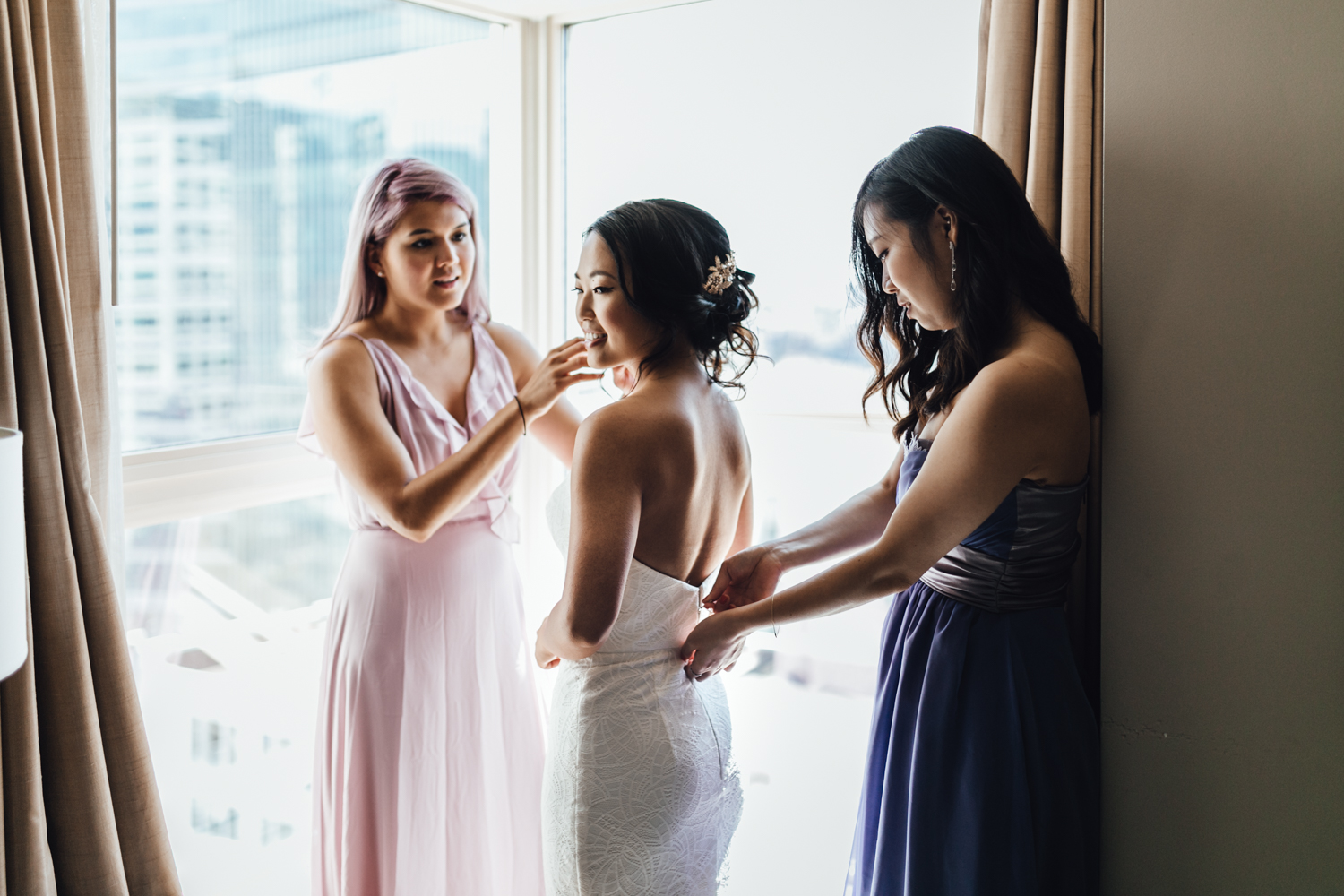 bride getting ready at auberge hotel in Coal Harbour, Vancouver BC wedding photography