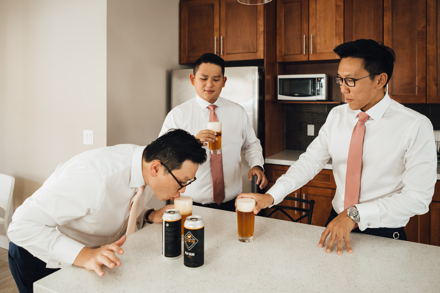 groom and groomsmen beer cheers singapore getting ready wedding photography