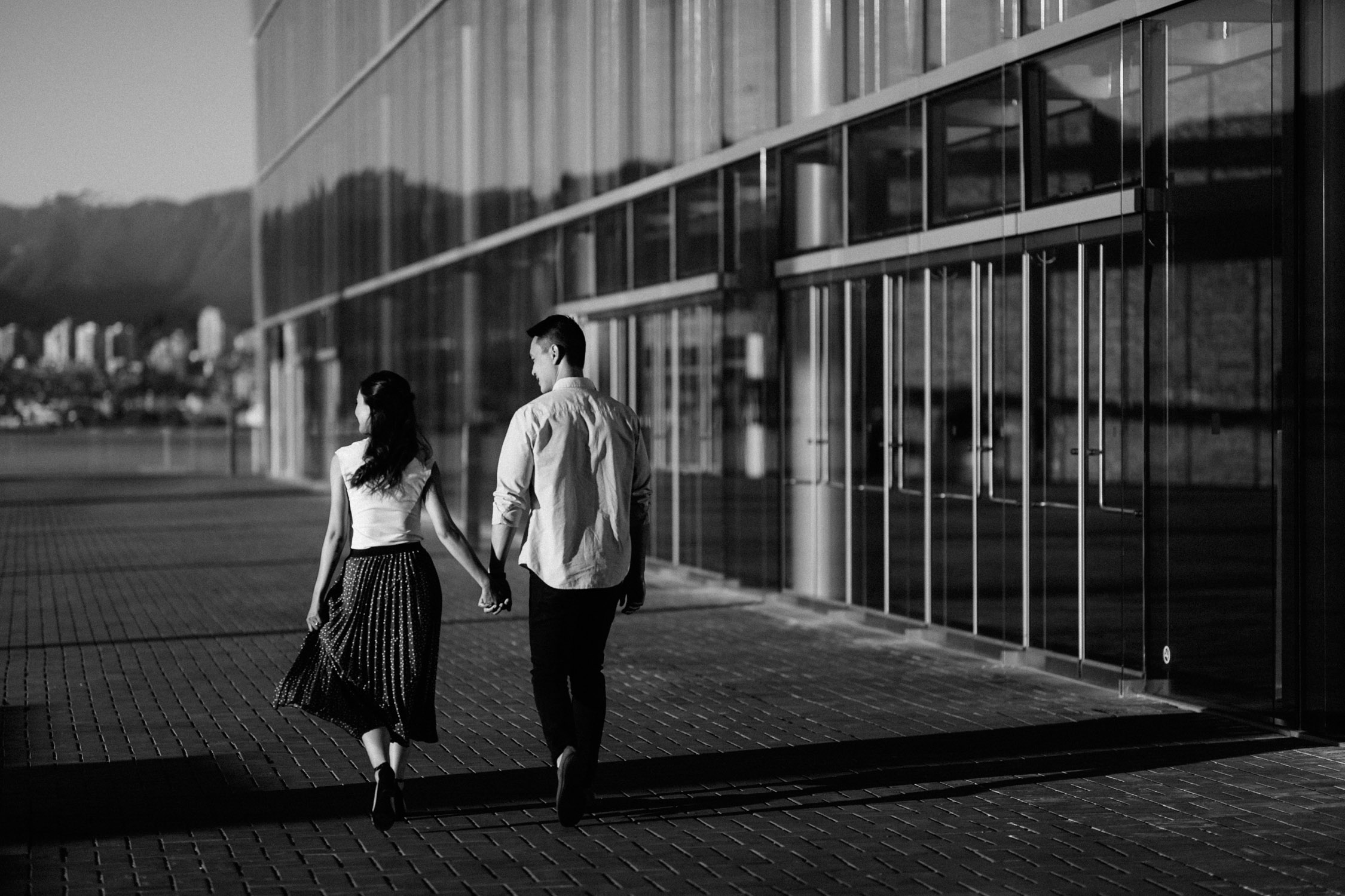coal harbour engagement photography in vancouver bc during sunset marine building