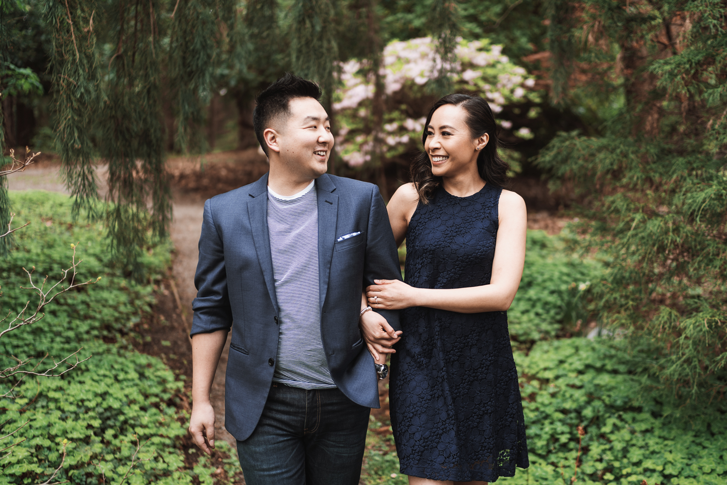 stanley park engagement photography in vancouver bc in spring with cherry blossoms