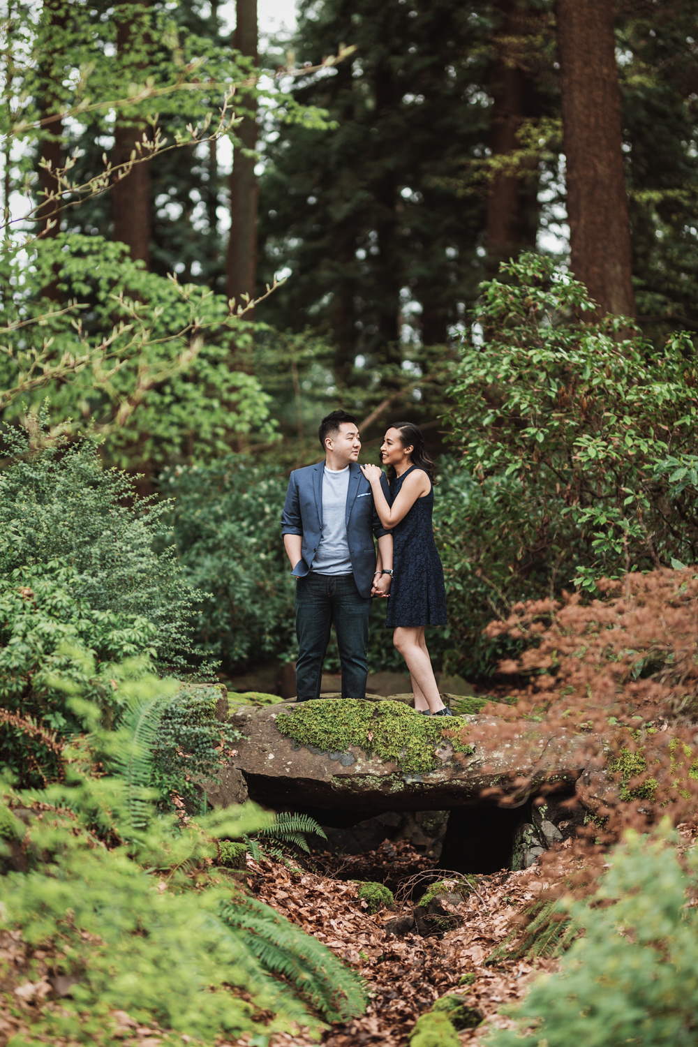 stanley park engagement photography in vancouver bc in spring with cherry blossoms
