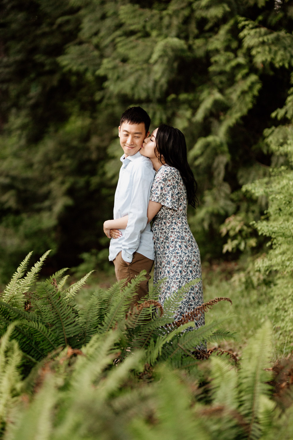stanley park engagement photography in vancouver bc during sunset or golden hour at rose garden